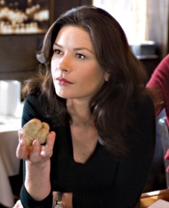 Zeta-Jones resists aging, succumbs to sugar.