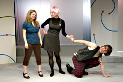 Andrea Change (Jen Moon) takes note as robot companion Trickle (LaChrista Borgers) teaches Johnny (Daniel Christensen) manners.