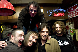 Shikany at the Rimrock, atop the shoulders of (l-r) Lloyd DeBarr, Fred Holzman, Jerry Battista, and Lynn Sorensen.