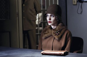 Jolie emerges as if from an Edward Hopper painting.