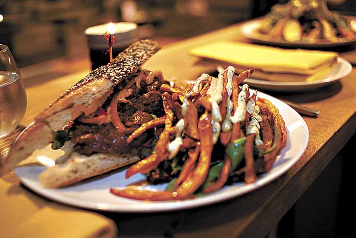 The BBQ sandwich is contained chaosa riot of flavor.