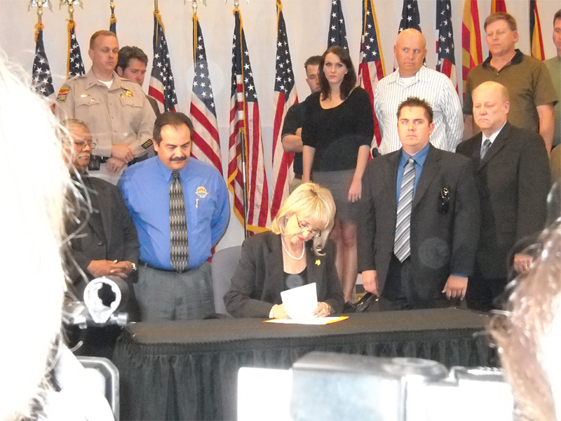 Governor Jan Brewer signing Senate Bill 1070.