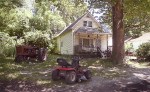 A crowd gathered behind this house in Washington Park, Illinois, to watch a series of dogfights on November 15, 2008.