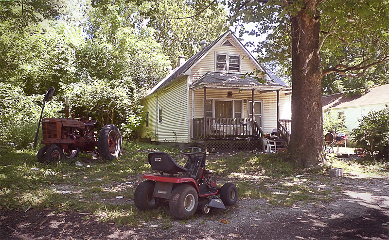A crowd gathered behind this house in Washington Park, Illinois, to watch a series of dogfights on November 15, 2008.