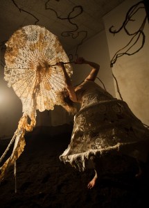 German wields her macram&eacute; parasol.