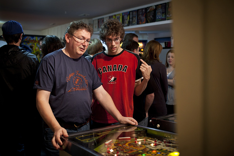 Robert and his dad Maurizio hash out strategy during a break in tournament play.