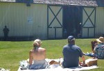 Sun-baked picnickers peer into the barn.