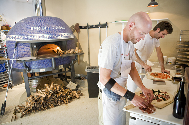 Cook Toby, left, and chef Jerry prepare their masterpieces.