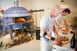 Cook Toby, left, and chef Jerry prepare their masterpieces.