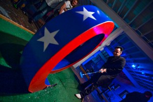 A possibly inebriated golfer loops the loop at Smash Putt.