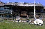 FBI agents sift through the charred remains of the University of Washington's Center for Urban Horticulture in Seattle.