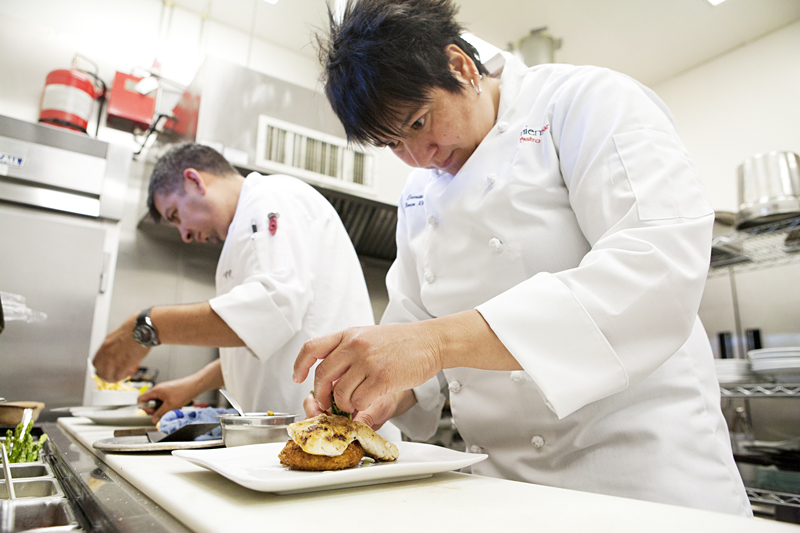 Rodriguez (right) fusses over her latest "work of art." View the slideshow here.