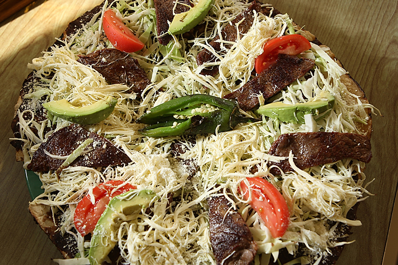 BURIEN, WA THURSDAY OCT 25 2012 El Tio Restaurant Restaurant El Tio, 452 SW 153rd St., Suite A, Burien, 242-2326. Mon.-Sun., 10 a.m.-10 p.m. Chapulines $4, Tlayuda $11.95, Molotes $7.50, Mole con pollo $8.75, Empanada de huitlacoche $9.25, Hot chocolate $3.50 (Photo By Kevin P. Casey)