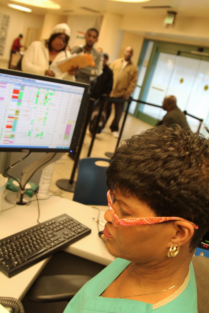 CNA Cynthia Y. Johnson searches her screen for beds.International Film Circuit