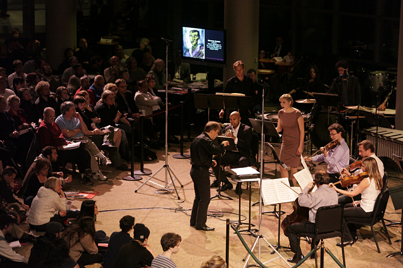 Ludovic Morlot conducts October's [untitled] . . . in the lobby.