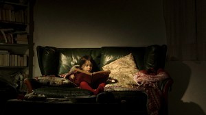 Lecomte reads scary stories to herself.