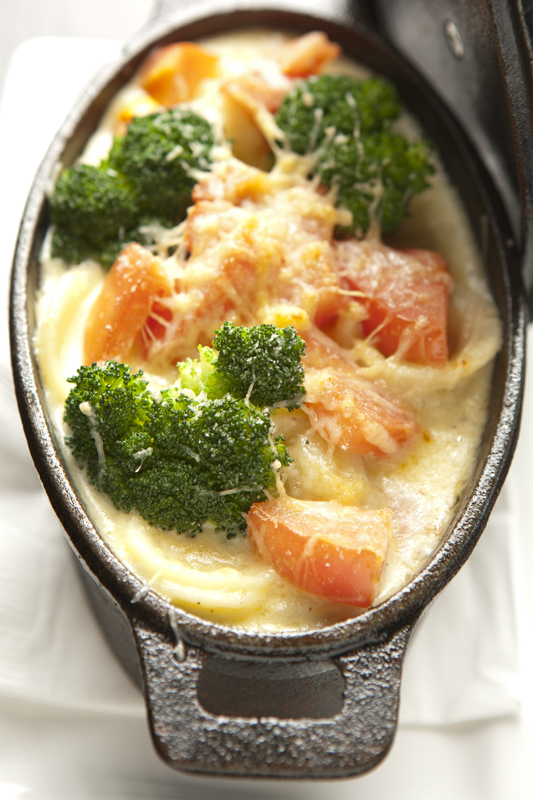 The mac-and-cheese is plated in a fashionable oval cast-iron dish, its floppy orecchiette noodles sunk in a mild well of cheddar, gruyere, jack and Velveeta cheeses. Selecting from a list of nine add-ins, students can transform the mac into an entree worthy of its sophisticated surroundings, gussying it up with feta or goat cheese. Or they might request bacon and blue cheese for a $9 approximation of the $15 truffle and duck ham mac-and-cheese served in The Coterie Room's cast-iron pots.