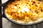 The mac-and-cheese is plated in a fashionable oval cast-iron dish, its floppy orecchiette noodles sunk in a mild well of cheddar, gruyere, jack and Velveeta cheeses.