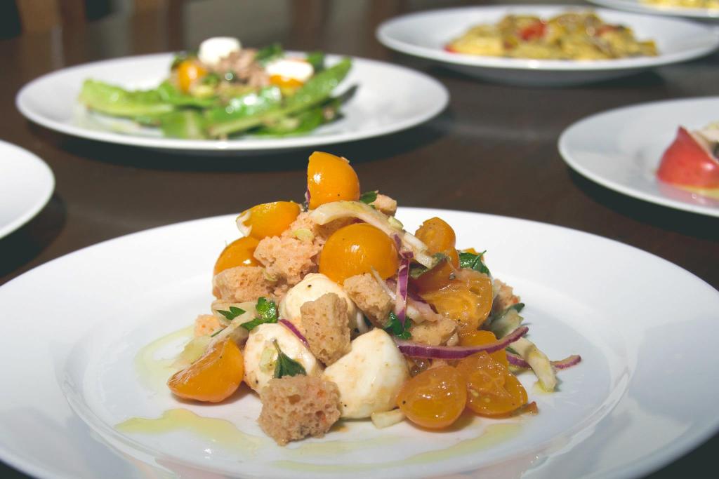 Cantinetta. Salad of sun gold tomatoes, thin sliced fennel and red onions, mozzarella, and vinegar chile soaked croutons.