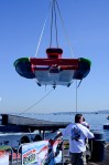 The hydroplane from Miss Madison Racing being moved from the pitsto the water.