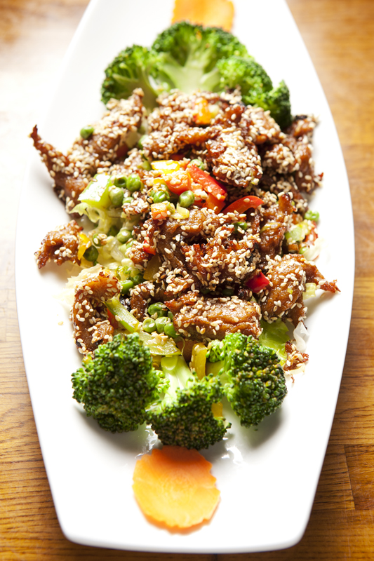 Carrots, interspersed with a sesame beef so convincing that someone ought to say aEœabracadabraaE when it's served, are trimmed into darling little ziggurats.