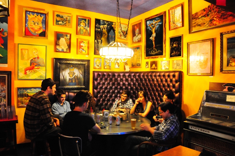 The walls are decorated with kitschy art.