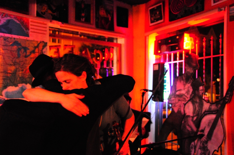 Violinist Annie Ford embraces trombonist Tom Yoder.  They both played music with Drew and Joe.