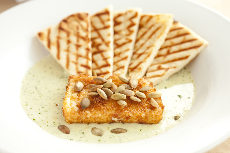 Rodriguez serves a perfect rectangle of spongy Mexican cheese, coated in panko bread crumbs and fried to a crisp, flaxen finish. The cheese and four grill-marked pita triangles are painstakingly positioned in an Easter egg-green cilantro and pumpkin seed cream sauce.