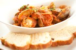 A stew of shrimp, scallops, Portuguese sausage and clams is made riveting by a zesty tomato sauce propped up by fennel and smoked pepper.