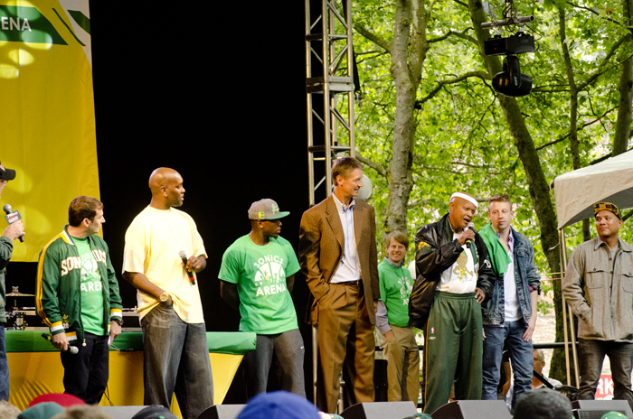 Chris Hansen, Gary Payton, Nate Robinson, Detlef Schrempf, Slick Watts, Macklemore, and MC Geologic from Blue Scholars all help wrap up the rally.