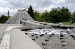 Below the new (2005) lid of Cal Anderson Park lies the old Lincoln Reservoir. Today, a volcano-like peak gurgles gently into a sluiceway and wider basin, designed by San Francisco artist Doug Hollis.