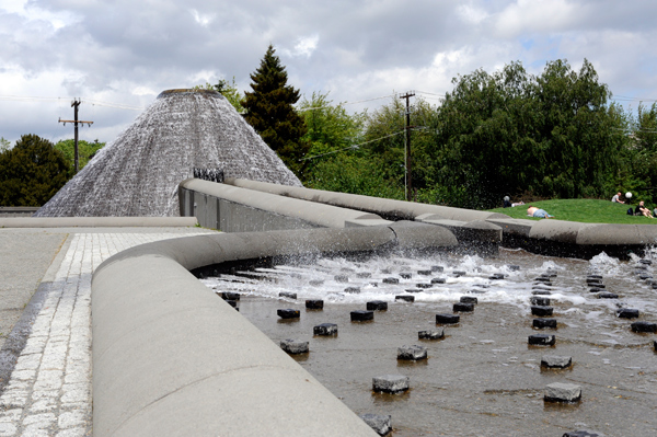 Below the new (2005) lid of Cal Anderson Park lies the old Lincoln Reservoir. Today, a volcano-like peak gurgles gently into a sluiceway and wider basin, designed by San Francisco artist Doug Hollis.