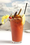 The Chuckanut Manor Signature Bloody Mary garnished with a large spiced wild prawn and salad. The Bloody Mary is made with ancho-chile house infused vodka.