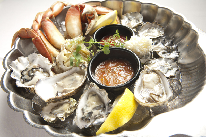 Half of a fresh Dungeness crab (from Samish bay, which the restaurant overlooks) with an assortment of Local Oysters.