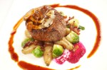 Center cut beef tenderloin filet with local oyster mushrooms, sauteed brussel sprouts and beet puree.