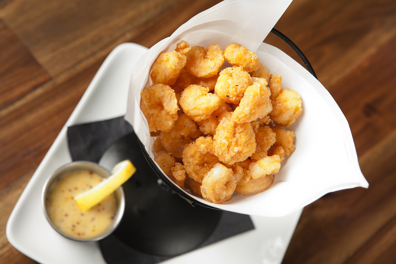 With the popcorn shrimp, the shrimp are watery plugs ofnothingness. An accompanying waxy honey mustard dressing that really should be in a relationship with a different appetizer doesn't help much.