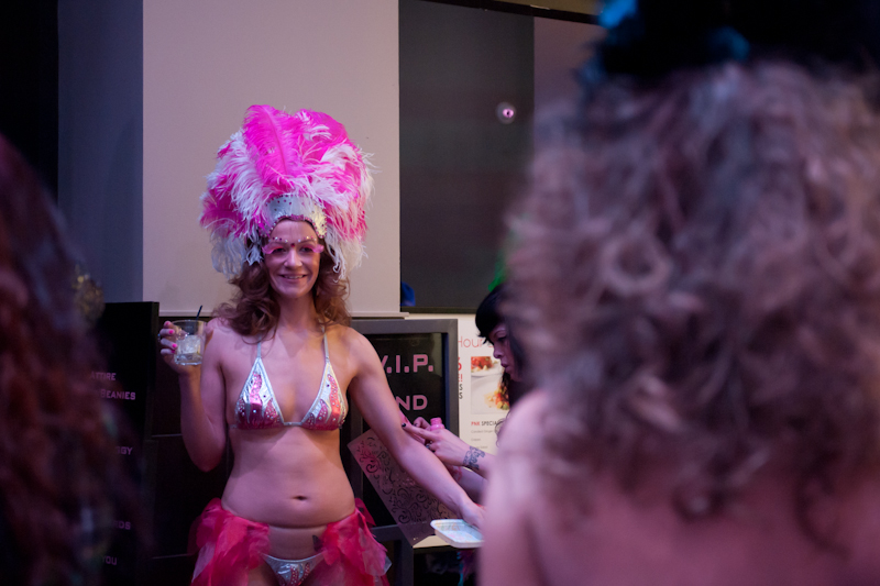 Models getting glammed up backstage.