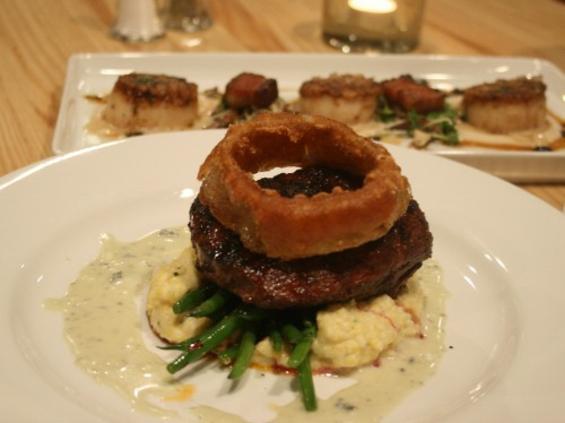 Sometimes the best thing about a steak is its onion. Filet Mignon with onion ring, cauliflower and potato puree, watercress, caramelized onions and shallot jus from The Hanger Room in Willemie, Minnesota.