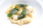 Duck agnolotti, with black truffle butter, and crispy sage.