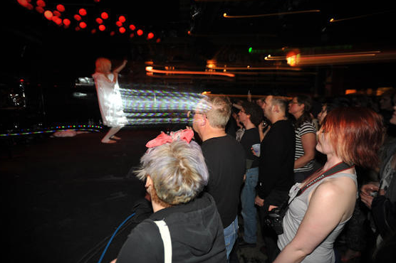 The stage, previously pitch black, was now lit up with a projection of crisscrossing, dim white lines, aimed from the foot of the stage so that the patterns played out on Danilova's white cloak. Already, this was a spectacle, but when Danilova lowered the hood of her cloak and stepped up to the microphone, shit got real.  Check out the rest here.
