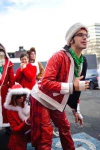 Some final adjustments are being made to this smokin' Santa's outfit.