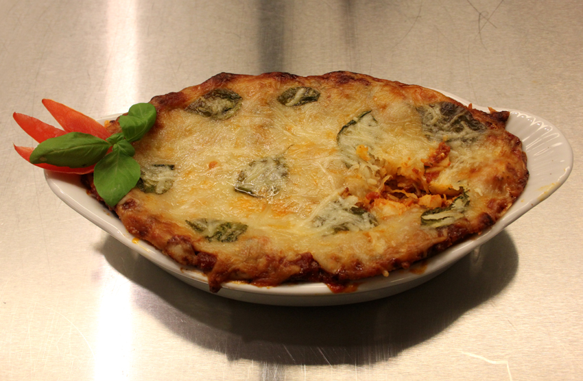 Lasagna, made by Jeremy.  Jeremy has been cooking seriously for 4 years and has been perfecting this recipe for 10 years.  This truck driver is always cooking for family and friends. Jeremy recently got into baking and now does cake decorating on the side. He loves it because it allows him to tap into his creativity.  When he was younger, he wanted to grow up and be an artist for Disney.