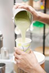 Pouring the green tea milkshake