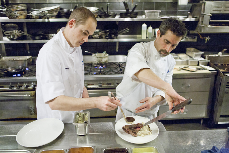 Executive Chef, Peter Levine platting up a dish with his Sous Chef.