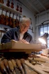 Doug Yule works on violins inside his workspace on Nov. 11, 2011.