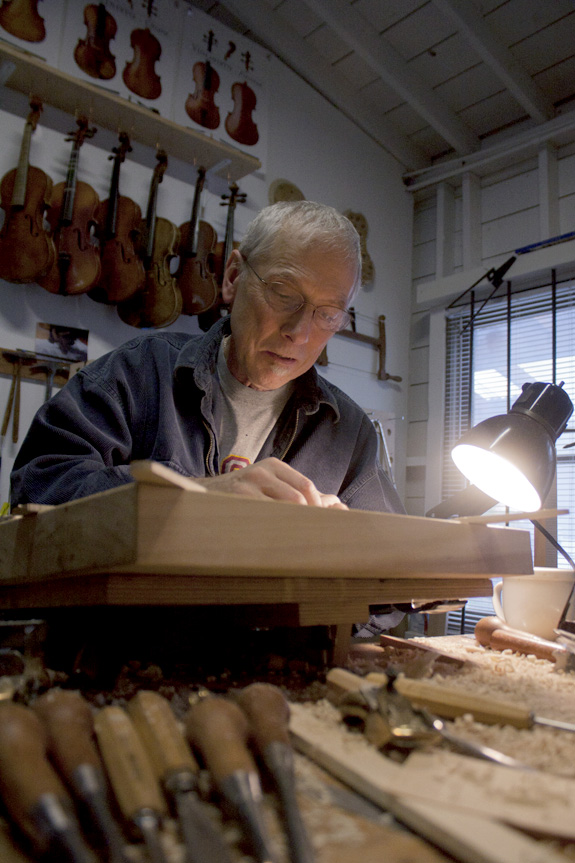 Doug Yule works on violins inside his workspace on Nov. 11, 2011.