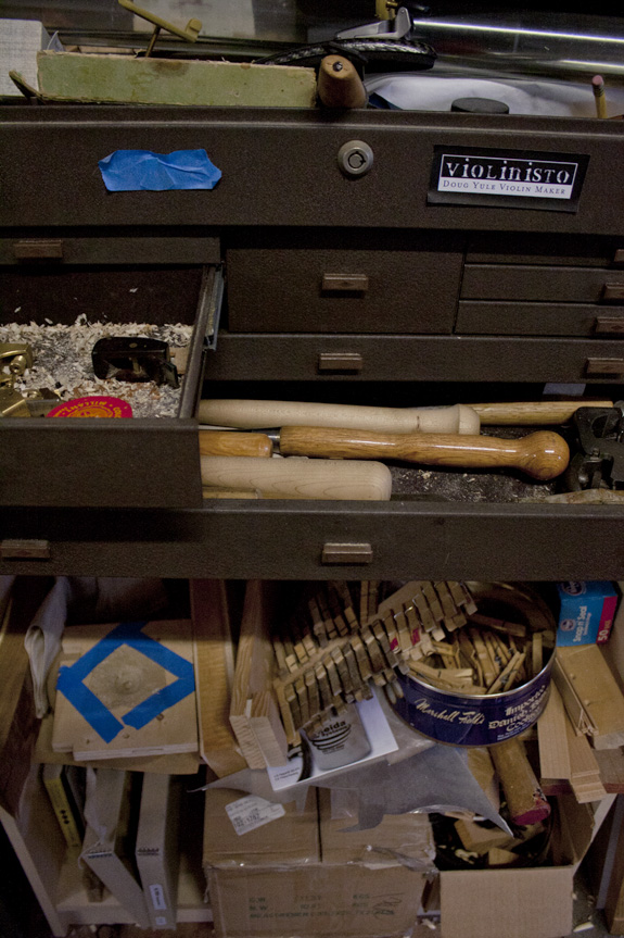 Doug Yule works on violins inside his workspace on Nov. 11, 2011.