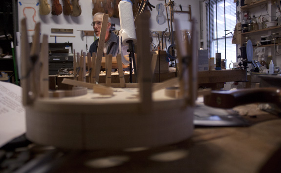 Doug Yule works on violins inside his workspace on Nov. 11, 2011.