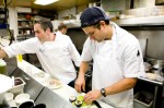 Line cook, Chris and executive chef Jonathan, platting dishes for hungry customers.