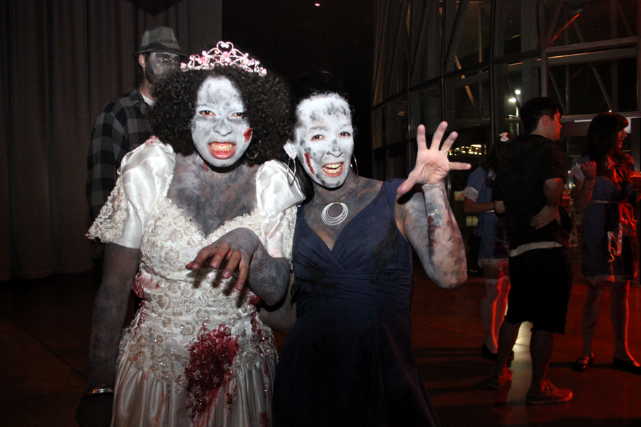 Cassandra Giggy and Jasmine Stewart dress up as a zombie bride and bridesmaid.